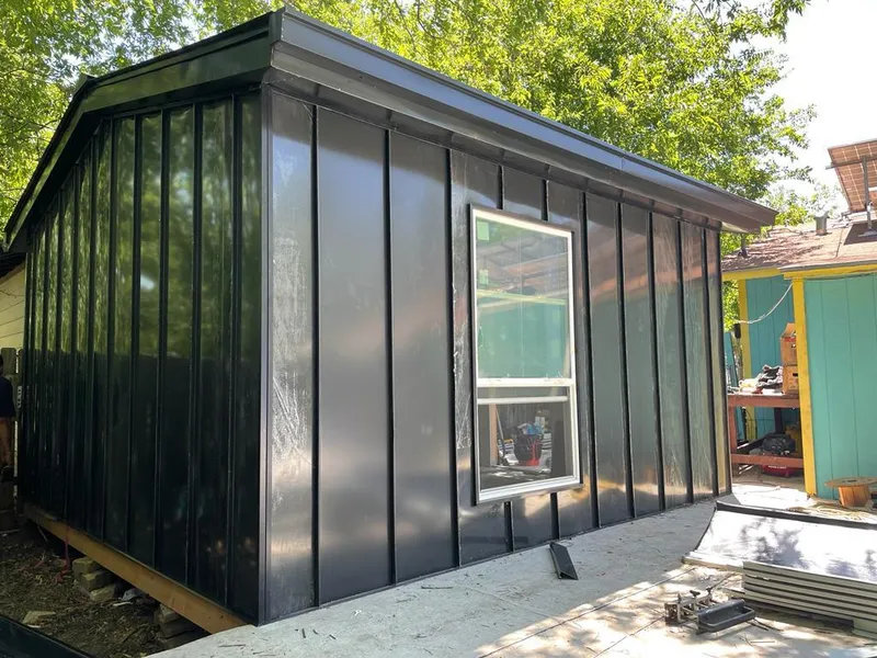 Black standing seam metal wall panels for Roof Inspection in Standish