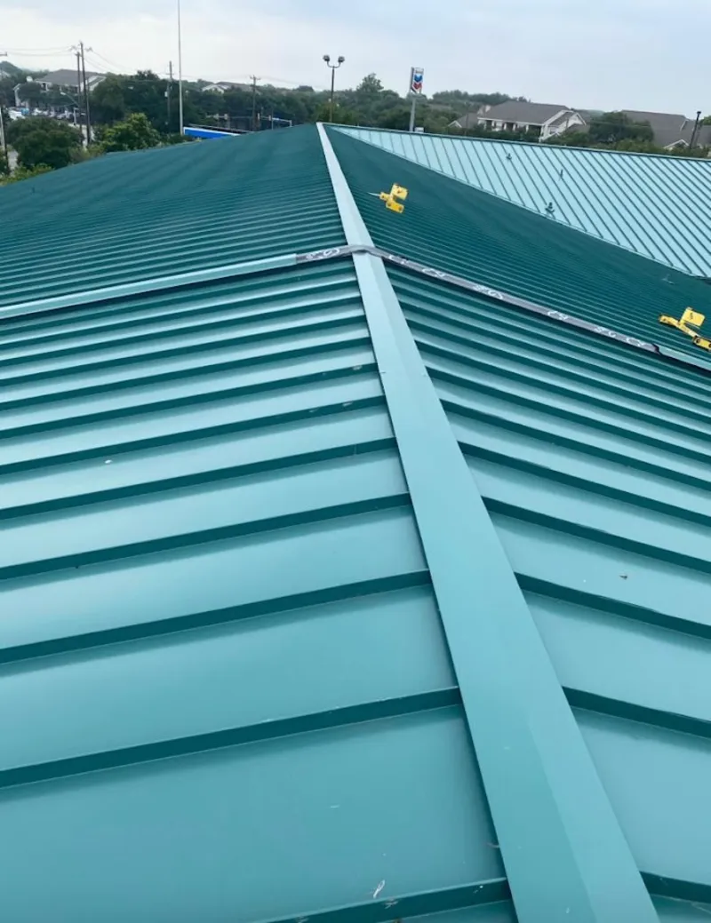 Green commercial metal roof ridge and valley for Metal Roof Repair in Standish